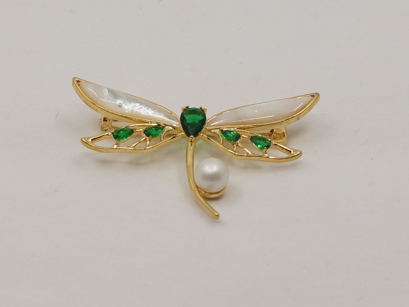 Emerald dragonfly brooch