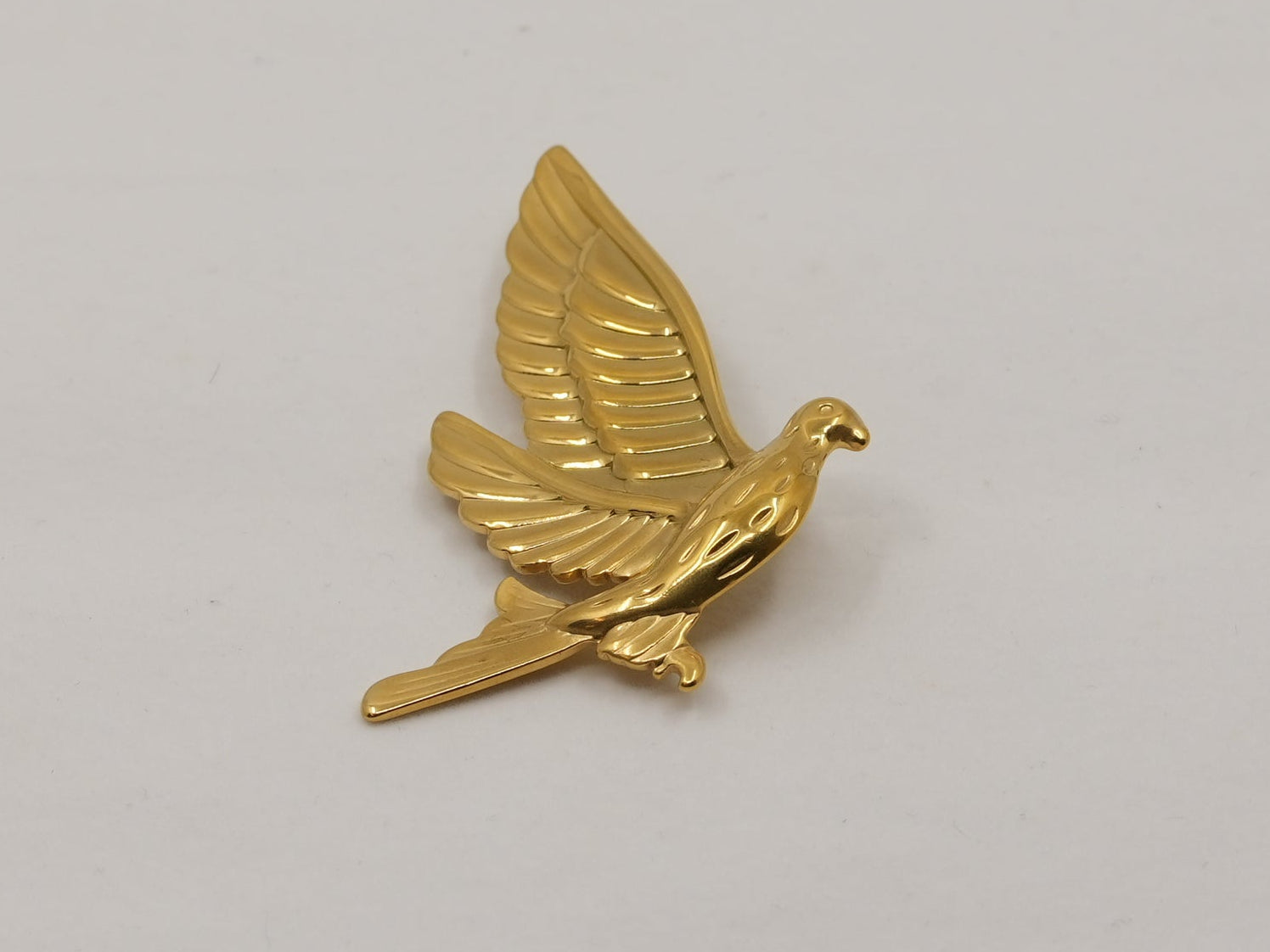 Golden falcon brooch