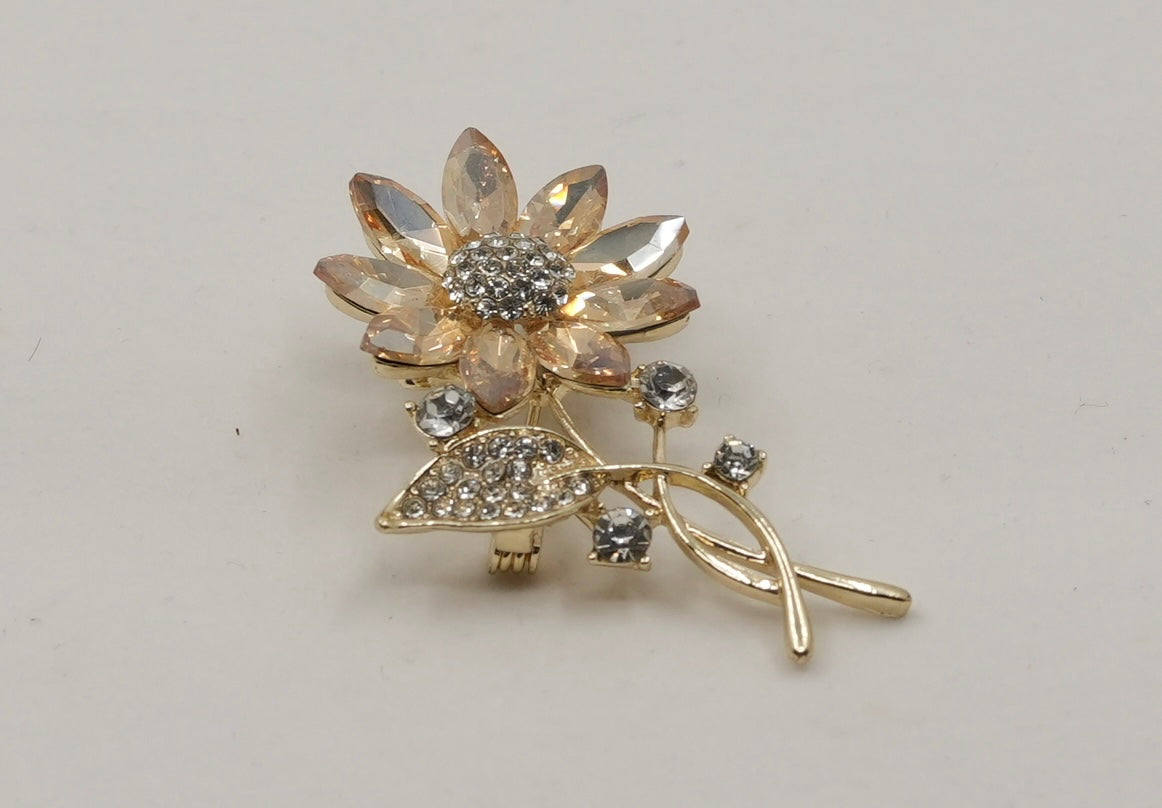 Crystal studded flower brooch