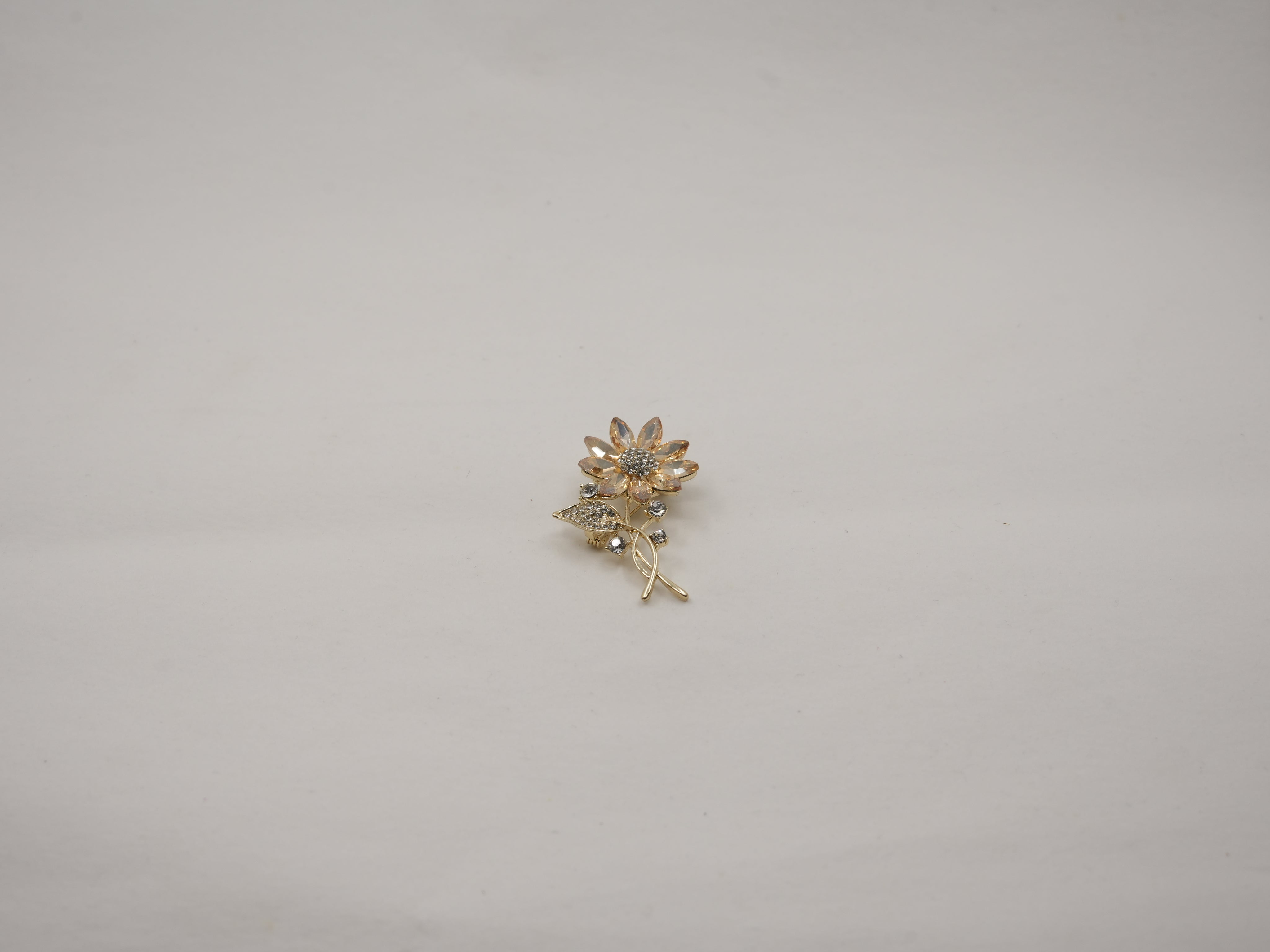 Crystal studded flower brooch