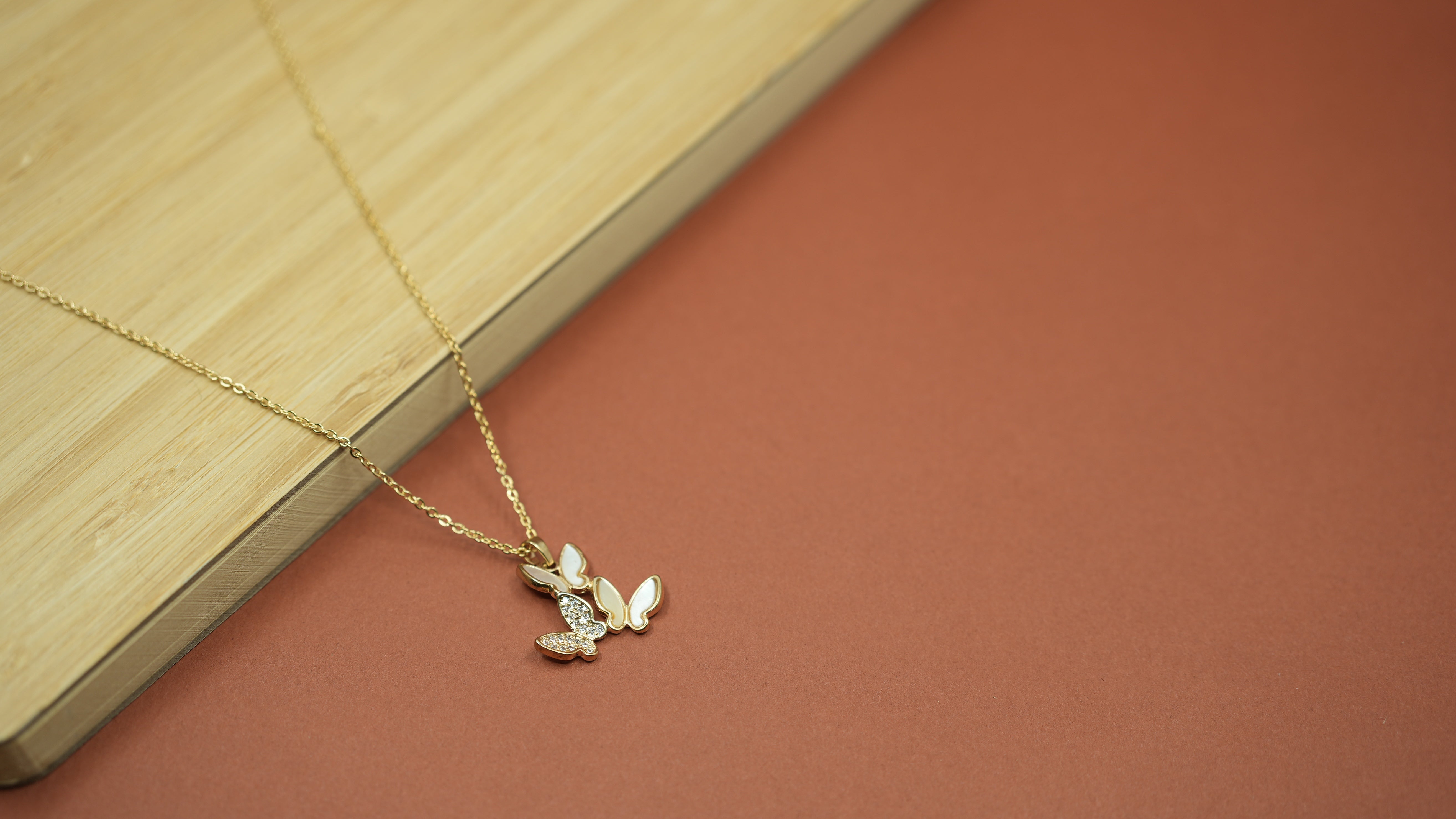 Tri flutter Gold necklace