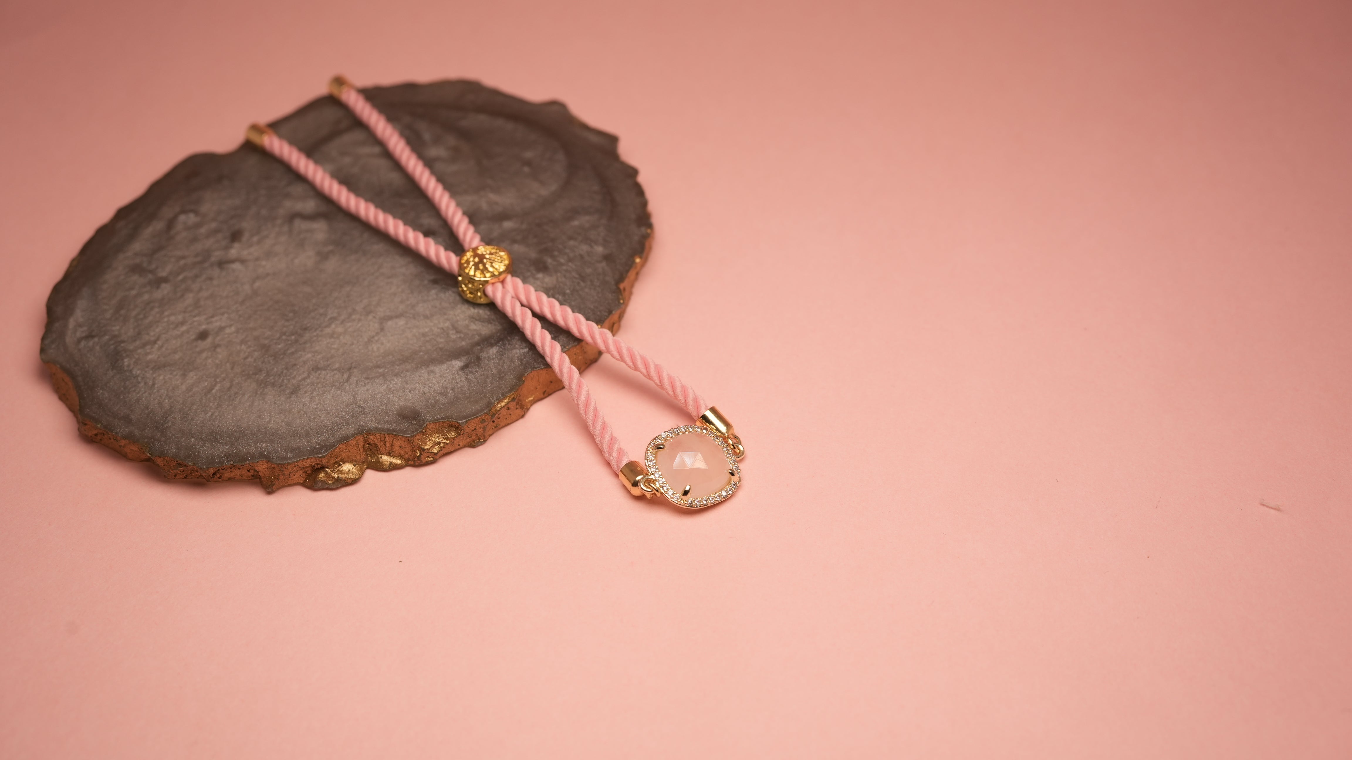 Square pink chord bracelet