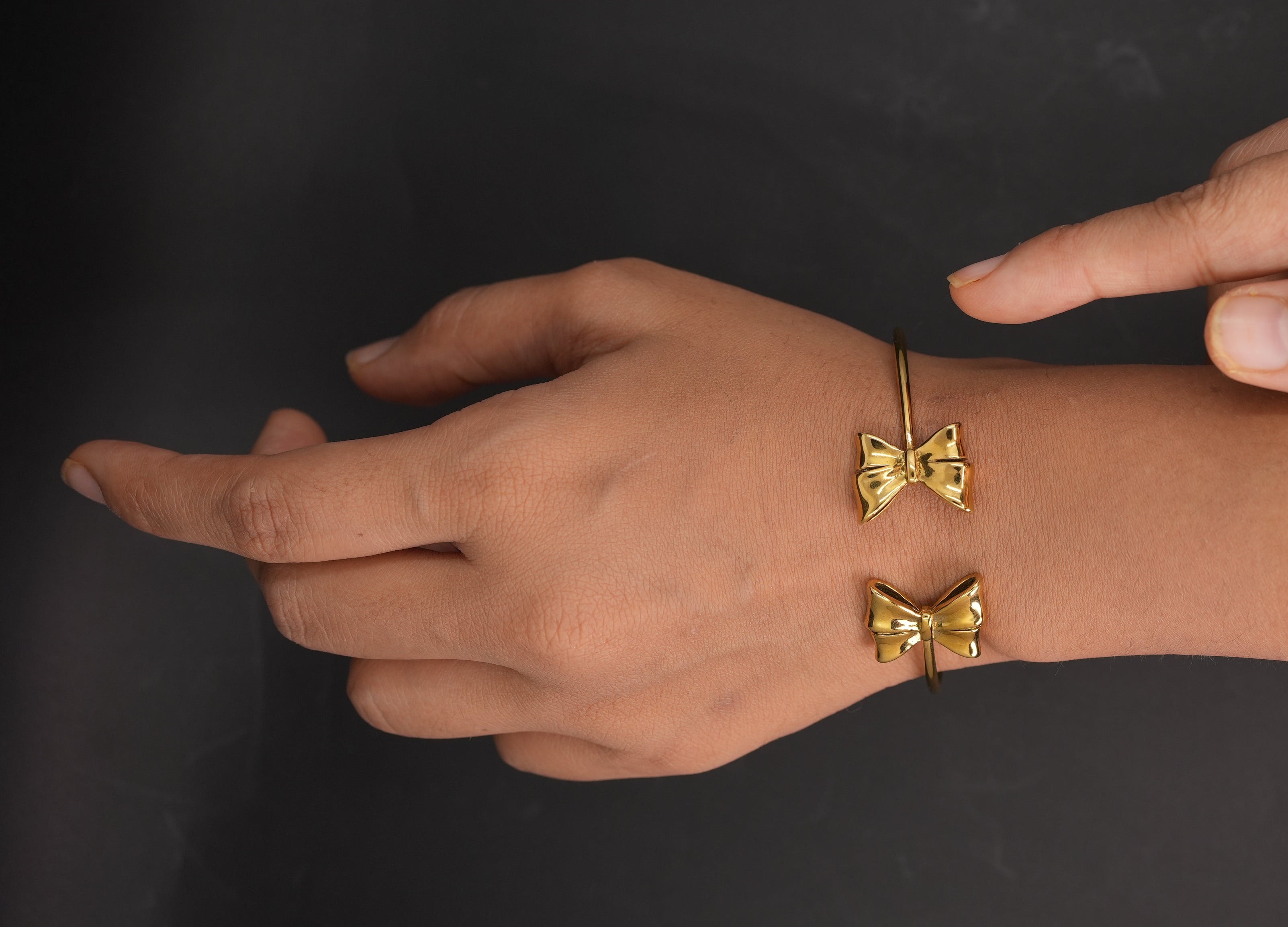 Bow and twirl cuff
