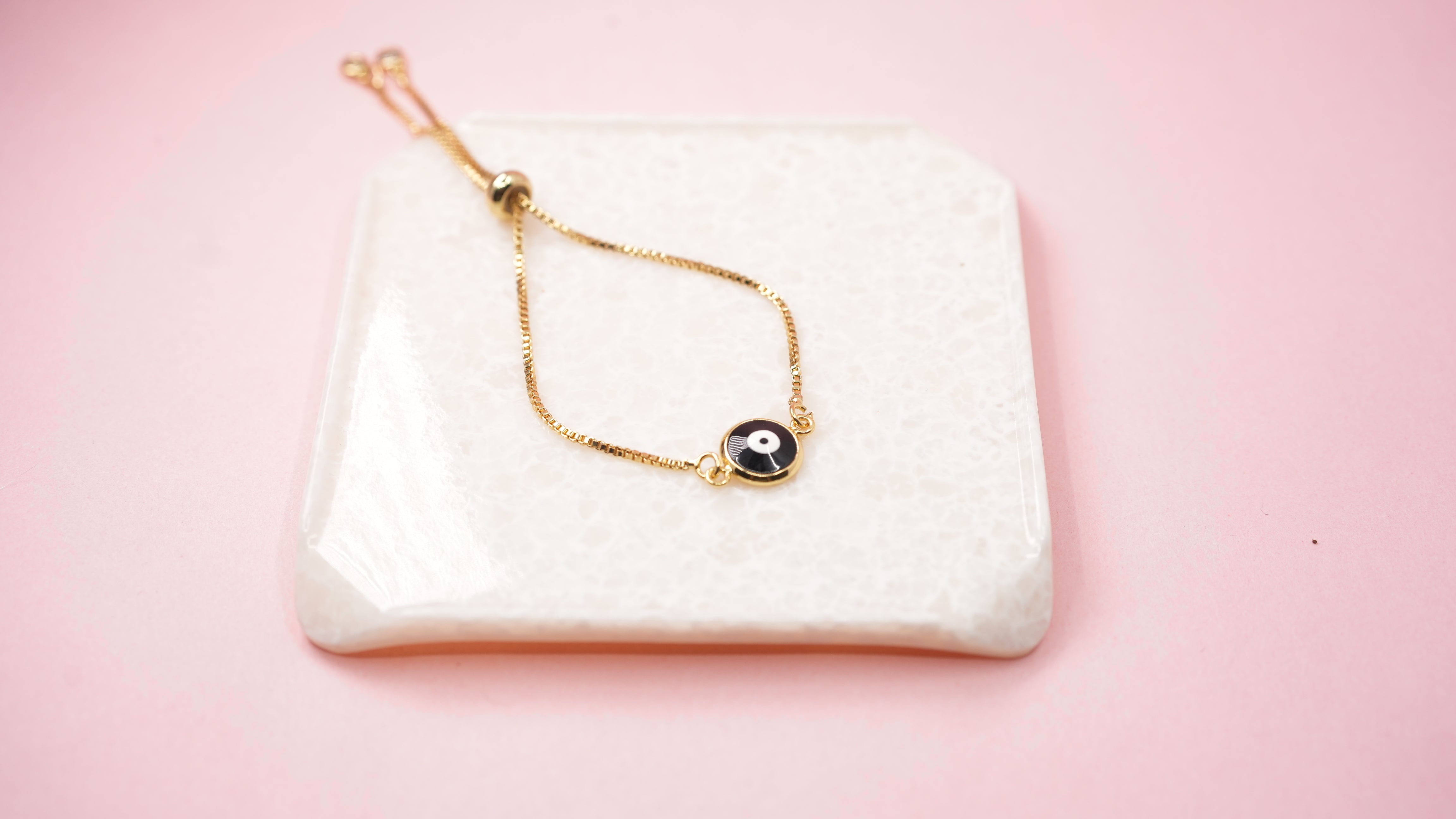Black eye amulet golden