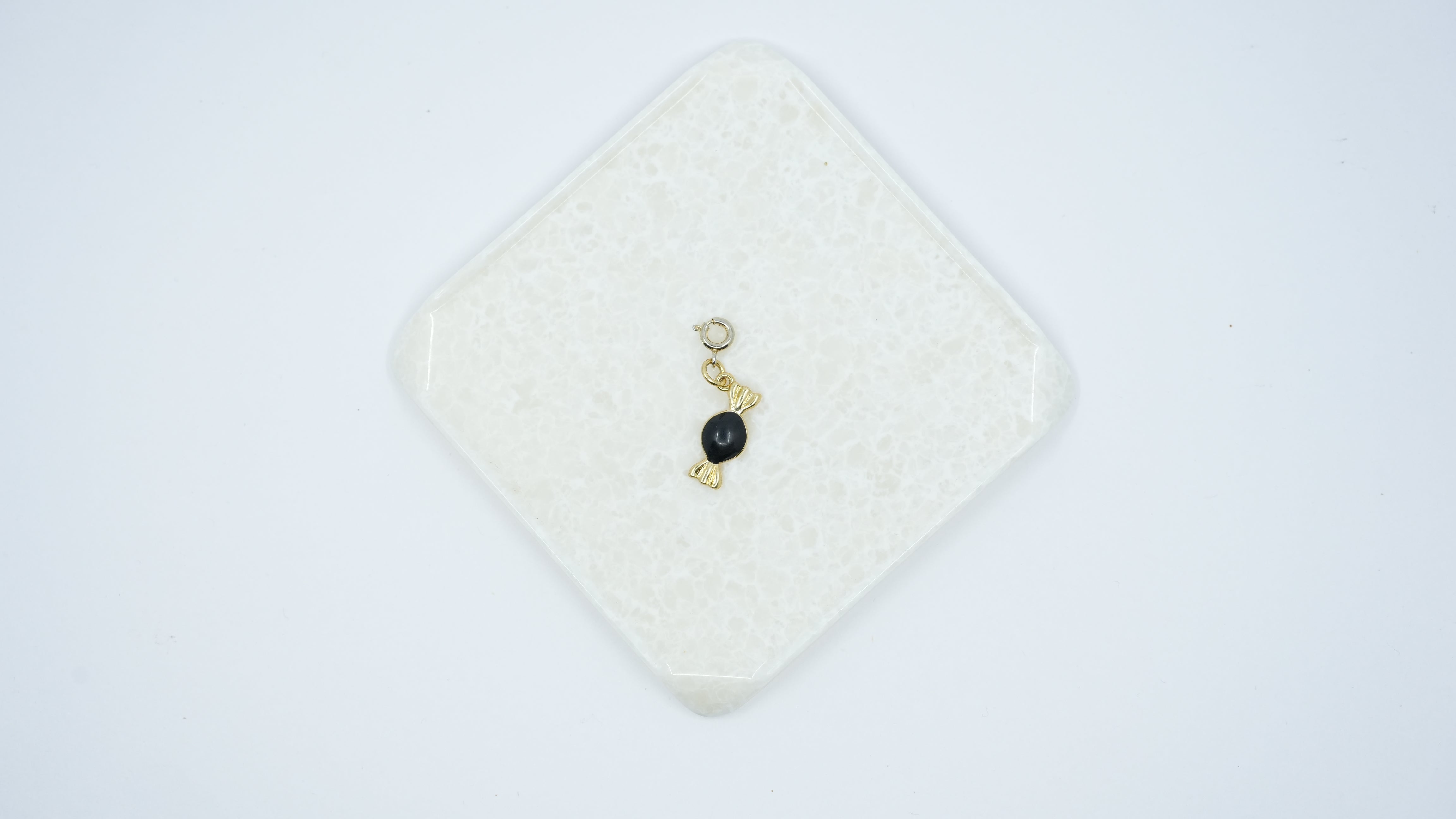 Black Whirl Charm