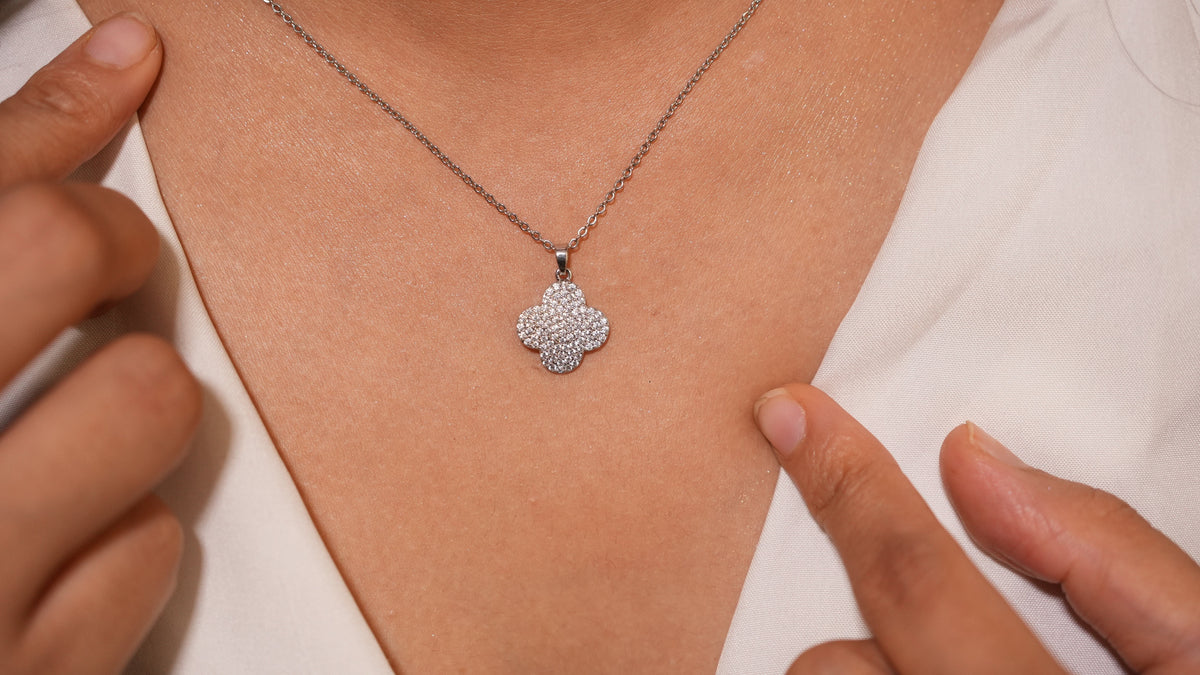 Daga-accessories Clovera silver necklace featuring a four-leaf clover pendant with sparkling pavé-set stones