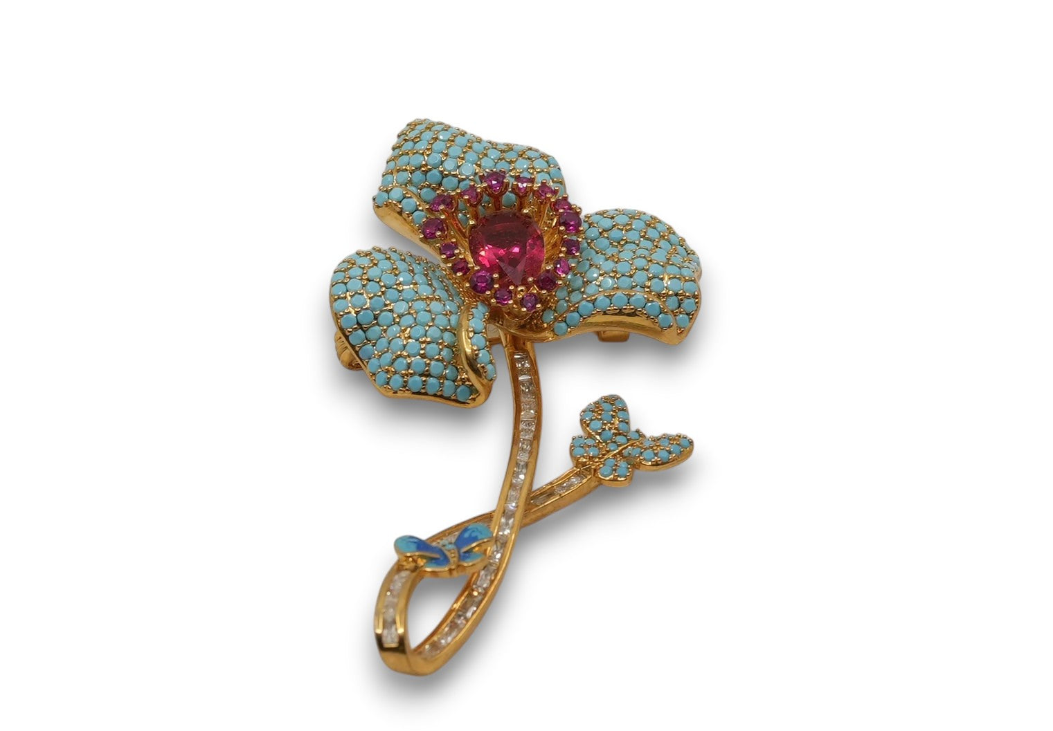 Daga-accessories floral brooch with turquoise pavé petals, a deep pink central stone, and crystal-accented stem.