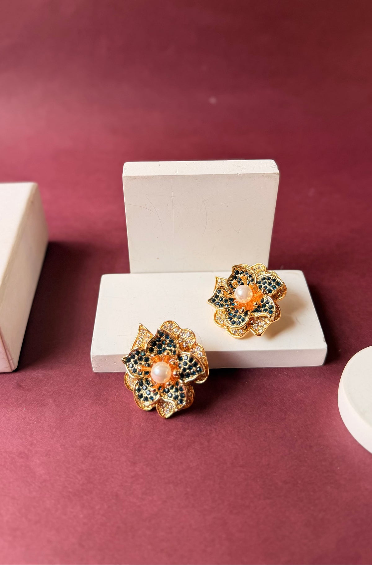 Daga-accessories Royal petal bloom flower stud earrings with blue and white stones and a central pearl