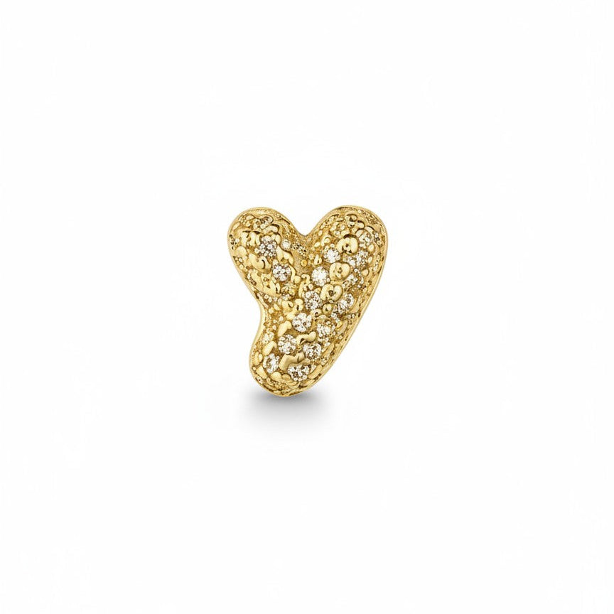 Daga-accessories gold-tone heart charm featuring shimmering pavé-set stones for a sophisticated, sparkling aesthetic.