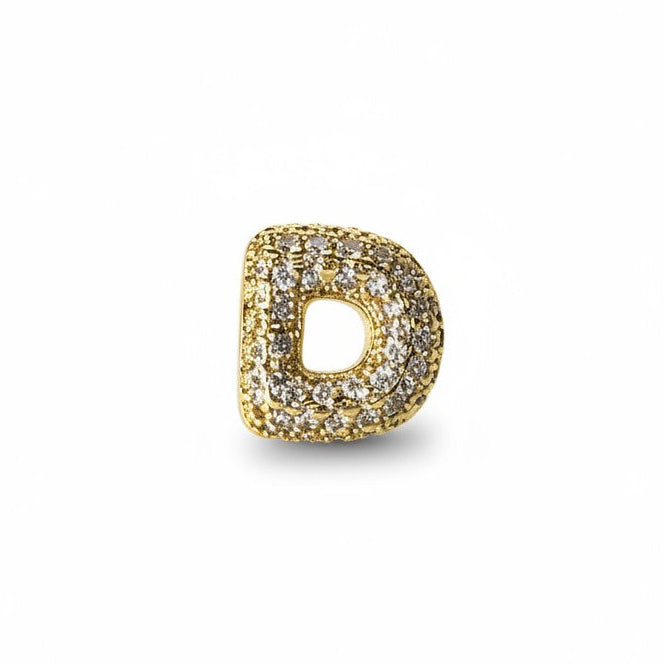 Daga-accessories gold-tone letter D pendant charm encrusted with shimmering pavé-set crystals on a white background
