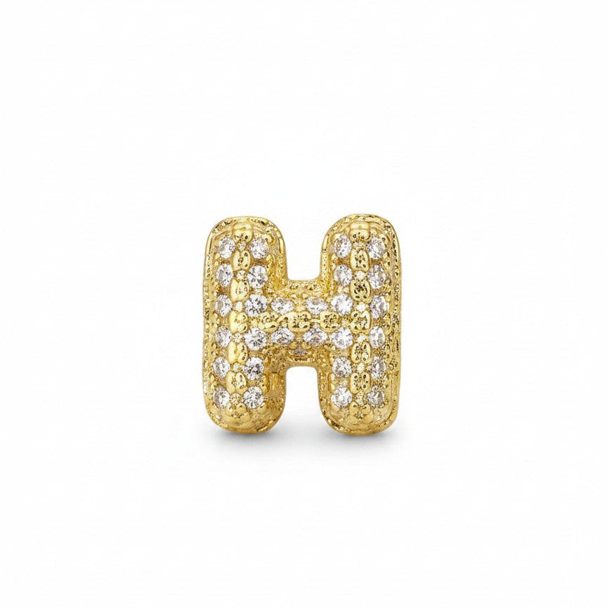 Daga-accessories gold-tone letter H pendant charm with sparkling pavé-style crystals on a white background