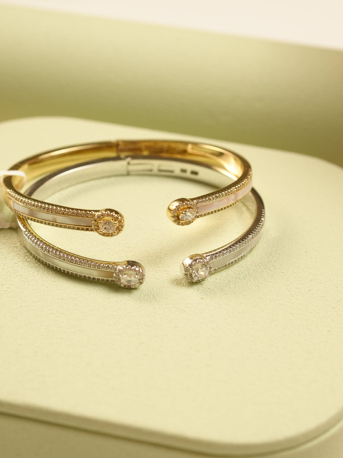 Daga-accessories Gold Pearl Radiance Bracelet set featuring lustrous pearls and gleaming gold and silver studs.