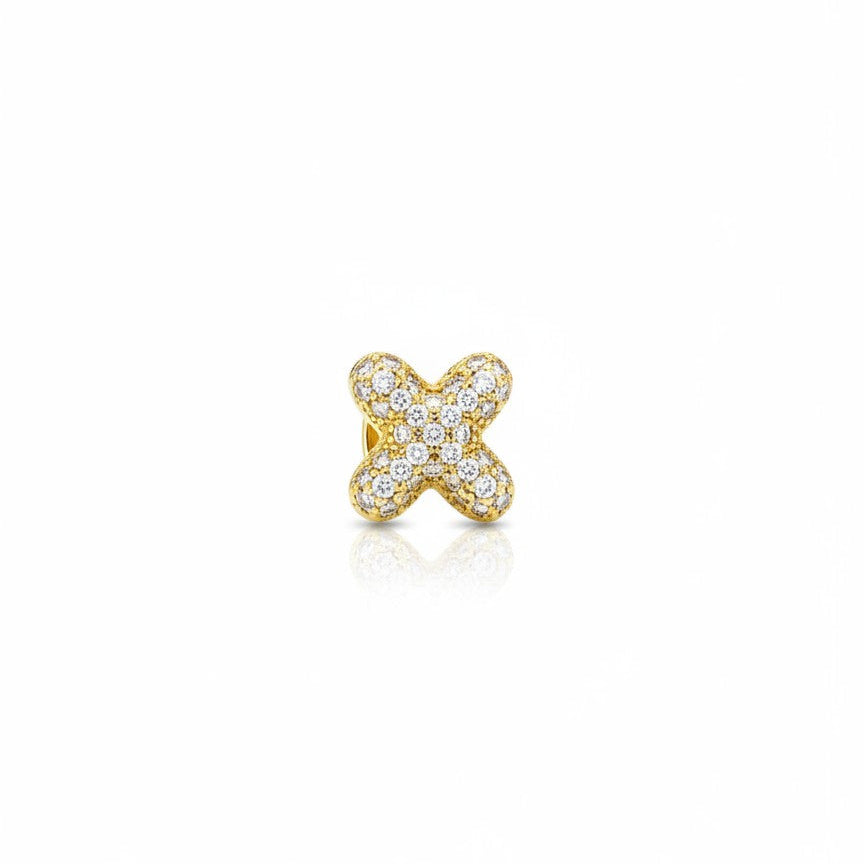 Daga-accessories gold-tone X-shaped charm featuring a shimmering pavé-style surface with sparkling clear stones.