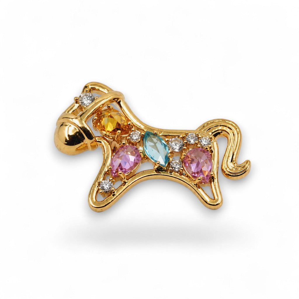 Daga-accessories horse-shaped brooch in gold-tone metal with multi-colored faceted crystals and clear accent stones.