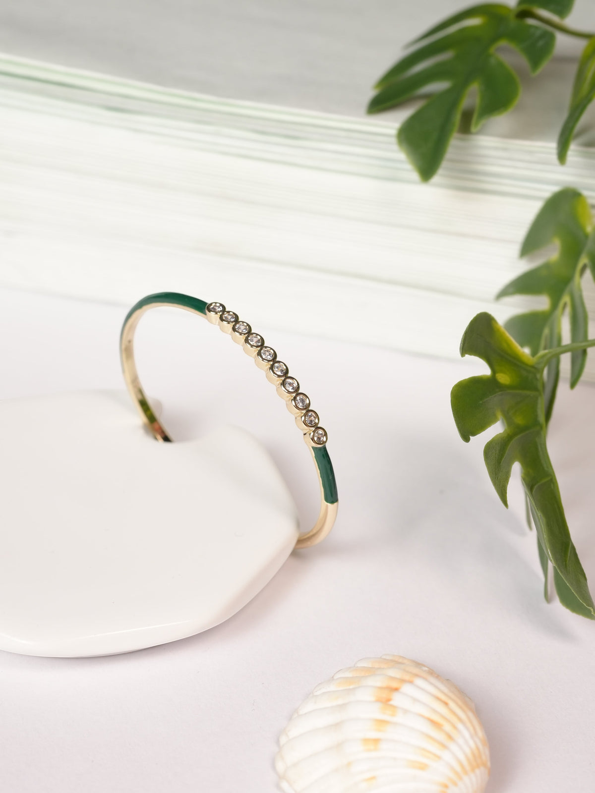 Daga-accessories olive green enamel bracelet with a row of sparkling crystals on a gold-tone band