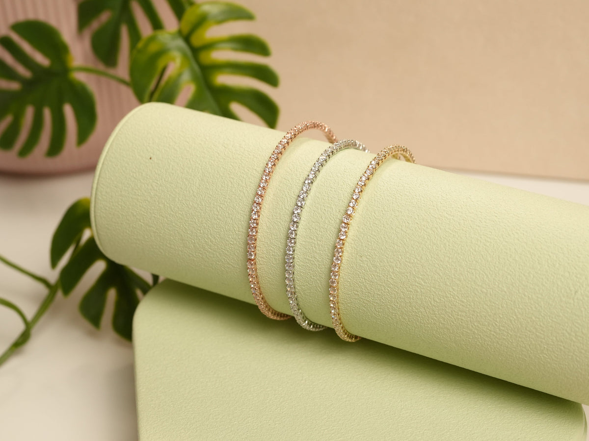 Daga-accessories Radiant Grace bracelets in silver, gold, and rose gold tones with delicate crystal stud detailing.