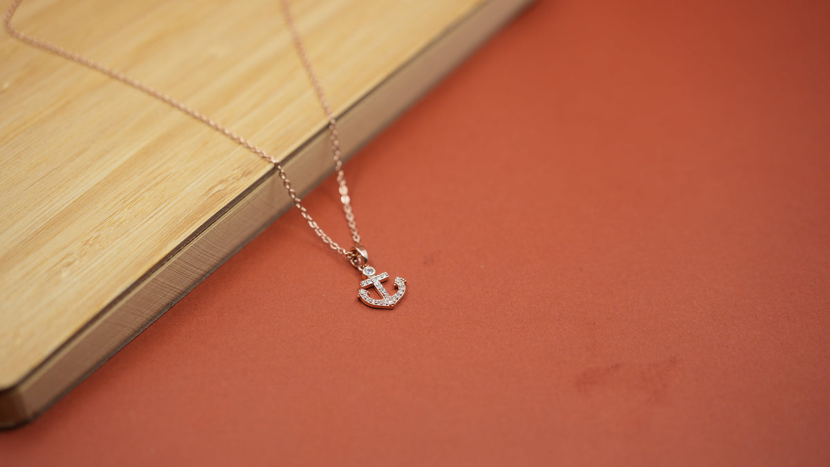 Daga-accessories rose gold anchor pendant necklace with shimmering crystals on a delicate chain