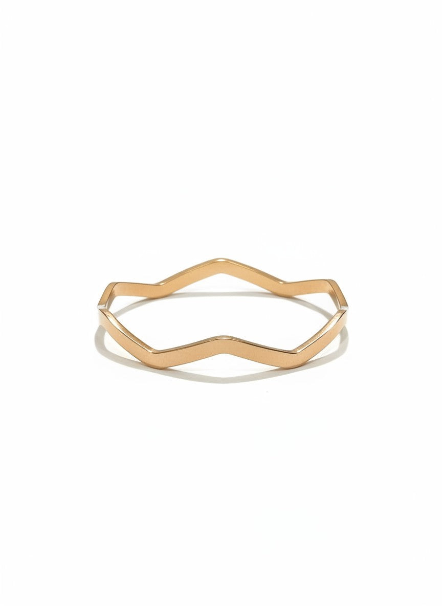 Daga-accessories rose gold-toned metal bangle with a minimalist geometric wave design and polished finish.