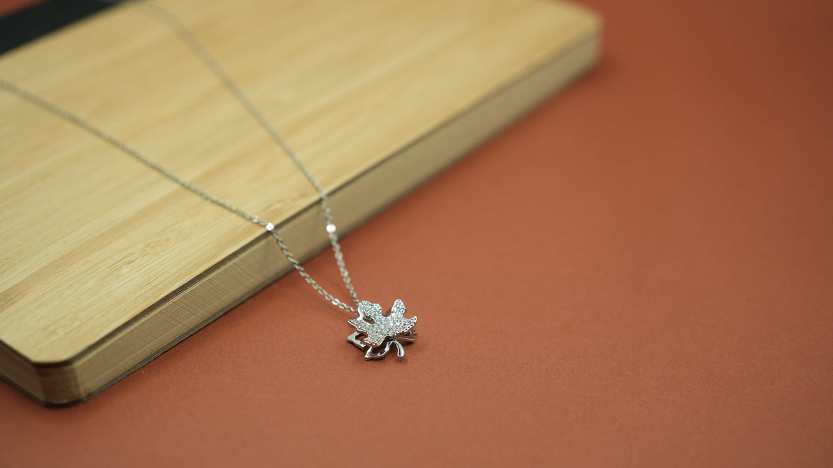 Daga-accessories silver maple leaf pendant necklace with sparkling pavé stones on a delicate chain