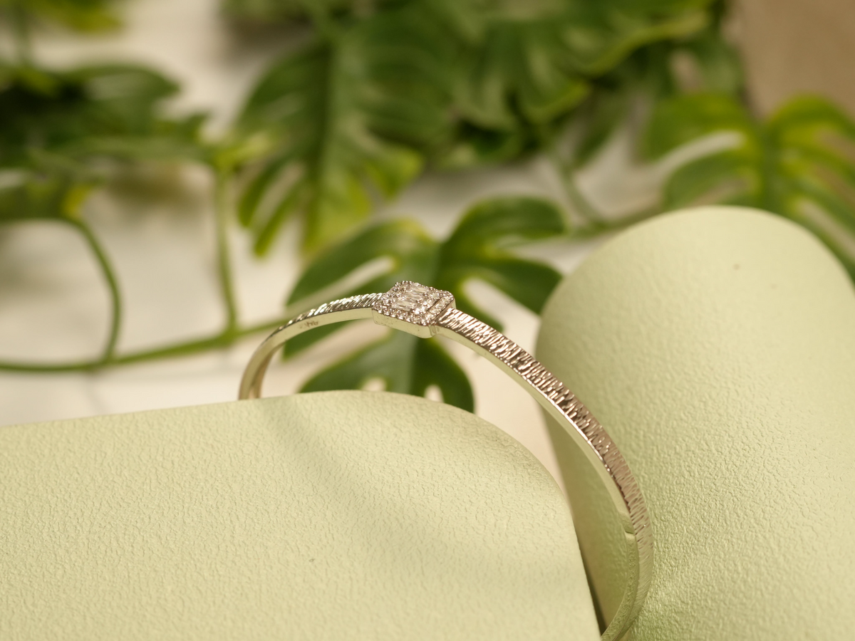 Daga-accessories silver textured metal bracelet featuring a square central stone with micro-stone accents